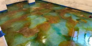 Ebony-Turquoise-Acid-Stained-Basement